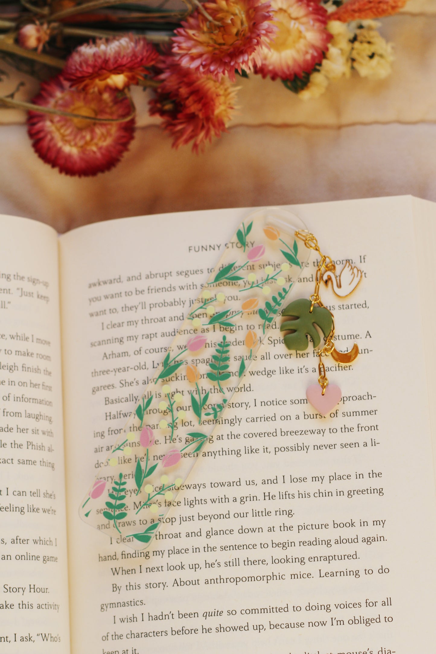 Decorative bookmark with floral design on an open book