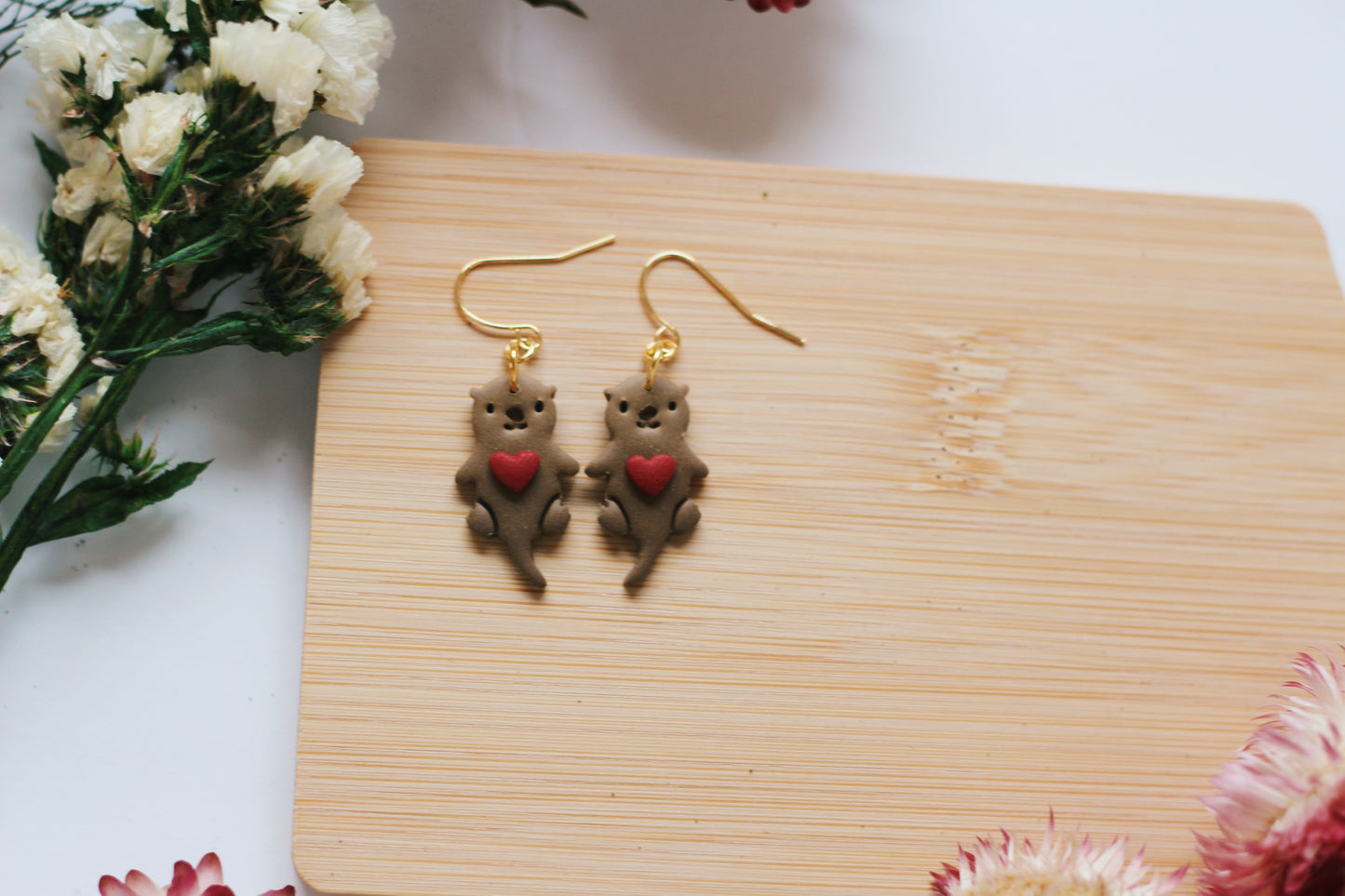 Otters Holding Hearts