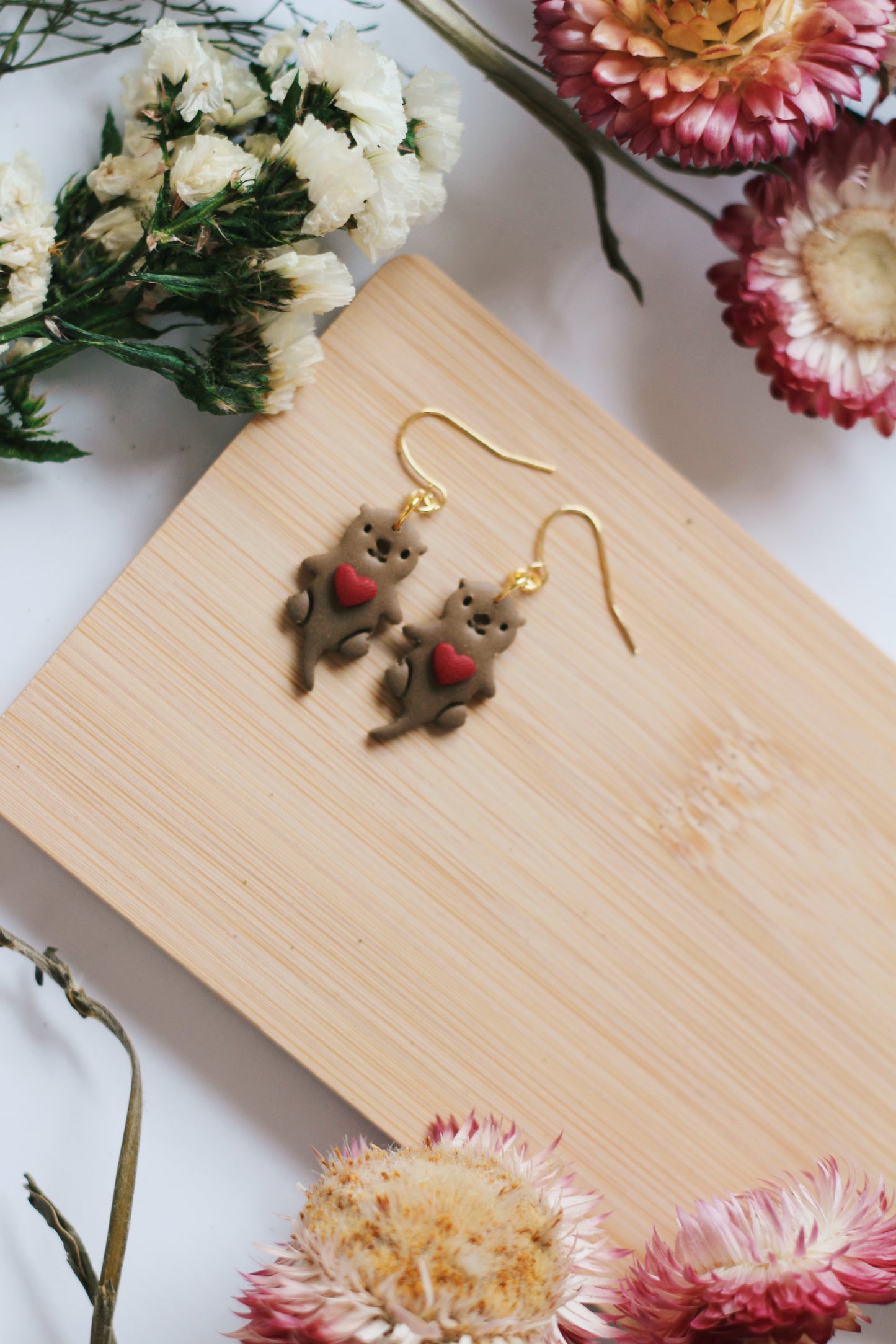 Otters Holding Hearts