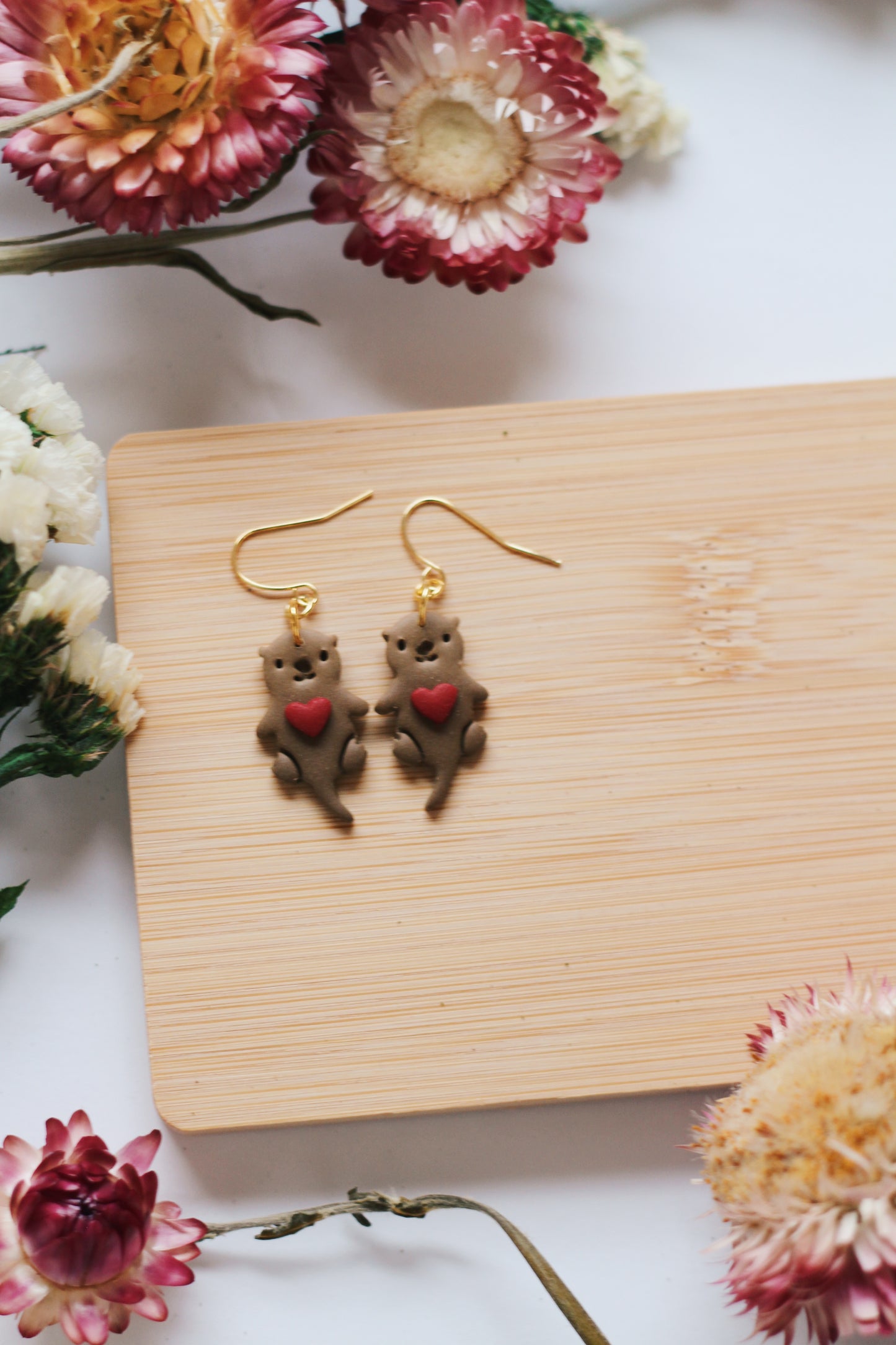 Otters Holding Hearts