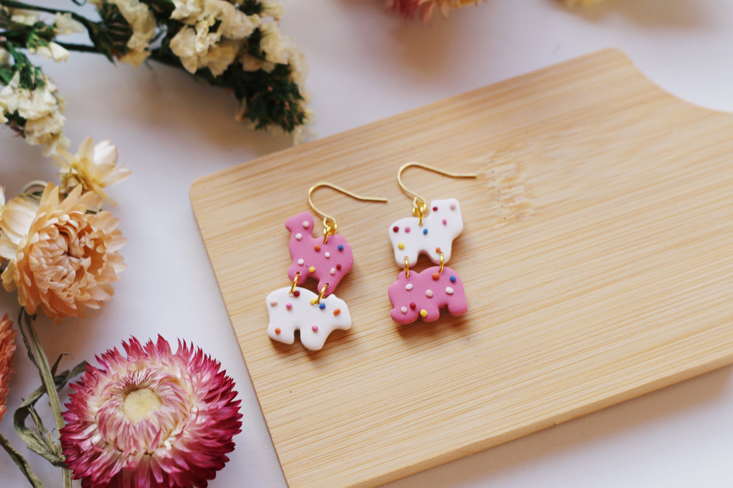 Pink and white sprinkle animal cookies earrings