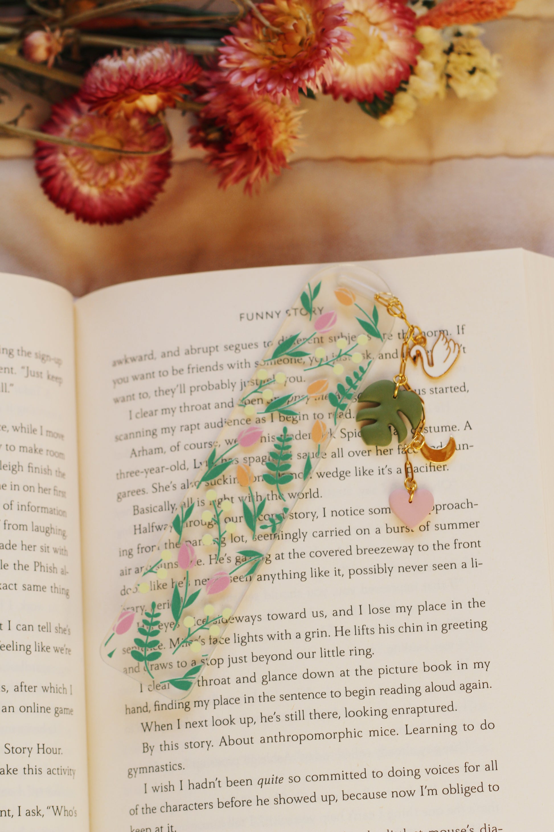 Decorative bookmark with floral design on an open book