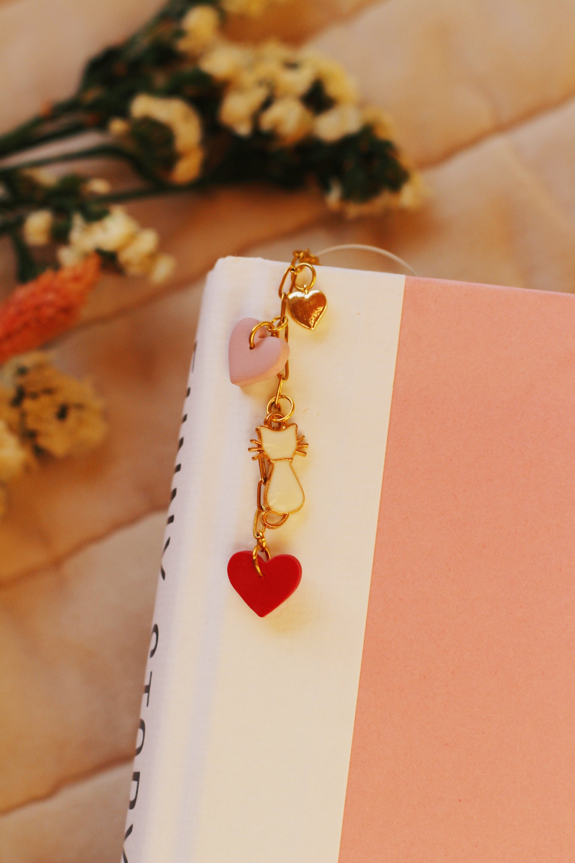 Bookmark with gold chain and red and pink heart and cat charms